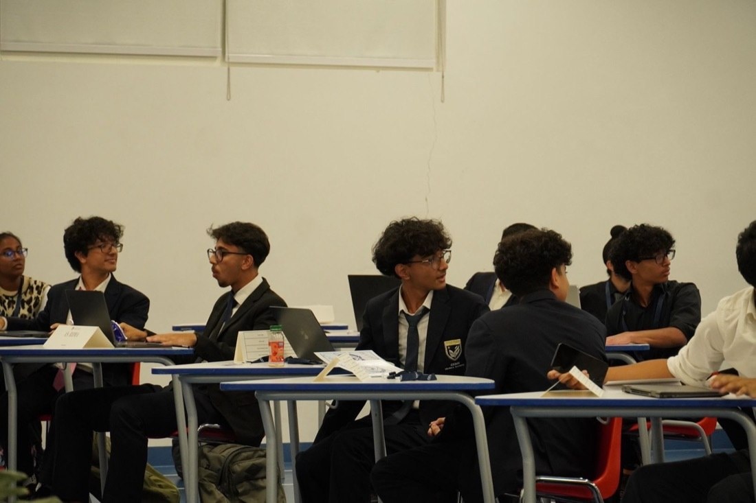 Delegates mid-debate in a GMAMUN committee session